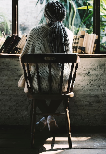 Free Photo portrait of a woman looking outside