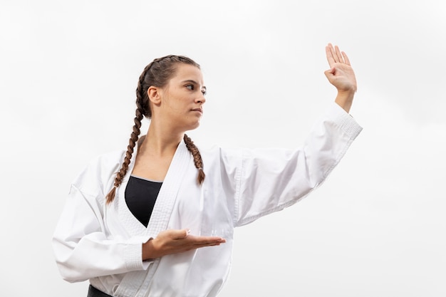 Free photo portrait of woman in martial arts costume