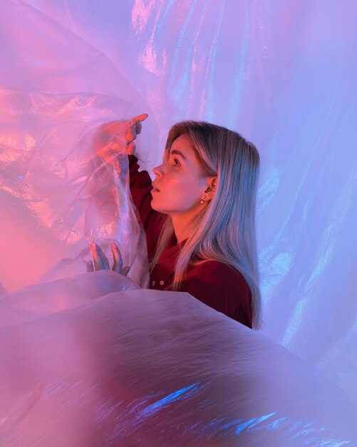 Portrait woman posing with plastic foil