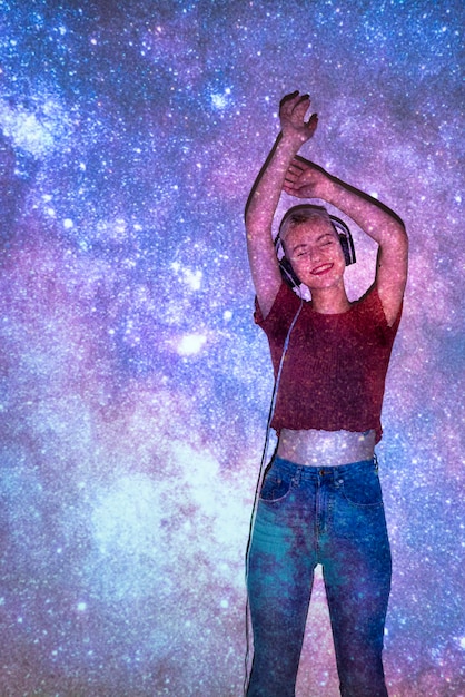 Free Photo portrait of woman posing with universe projection texture