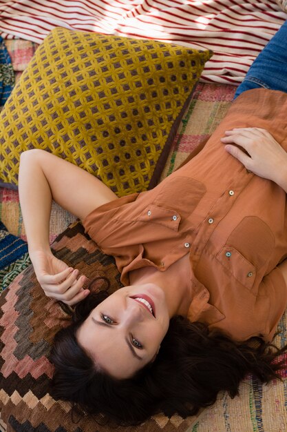 Portrait of woman resting in tent