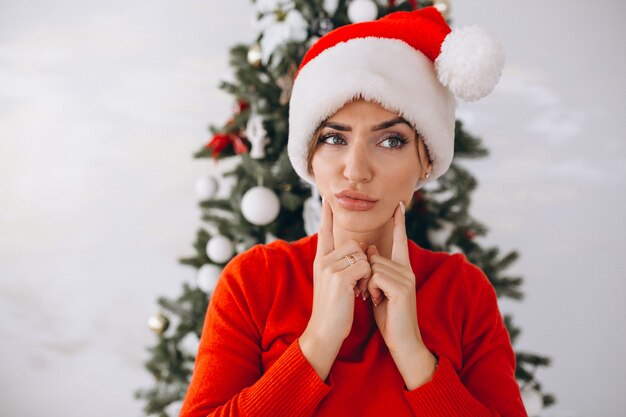 Portrait of woman in santa hat on Christmas