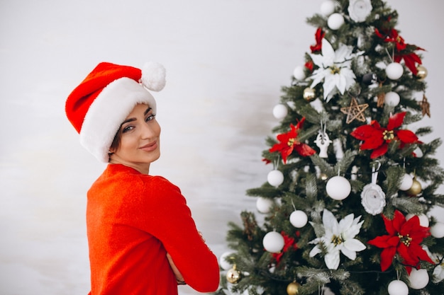 Portrait of woman in santa hat on Christmas