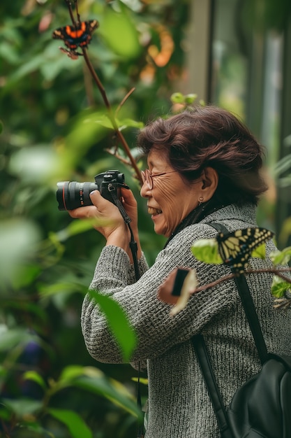 Portrait of woman taking photo with device for world photography day