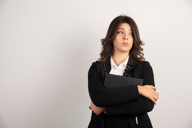 Portrait of woman teacher thinking about classes.