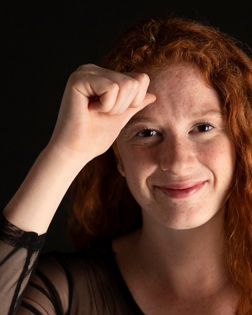 Free Photo portrait of a woman teaching sign language with copy space