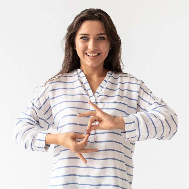 Portrait of woman teaching sign language