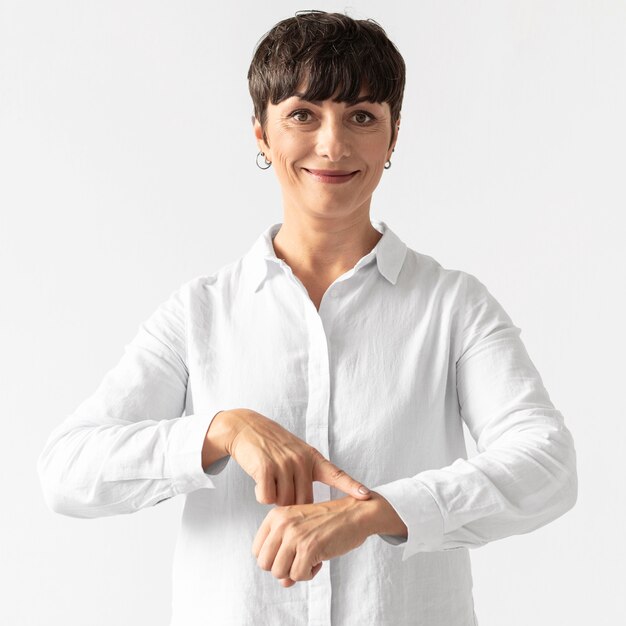 Portrait of woman teaching sign language