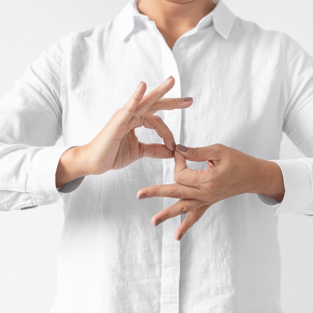 Free Photo portrait of woman teaching sign language