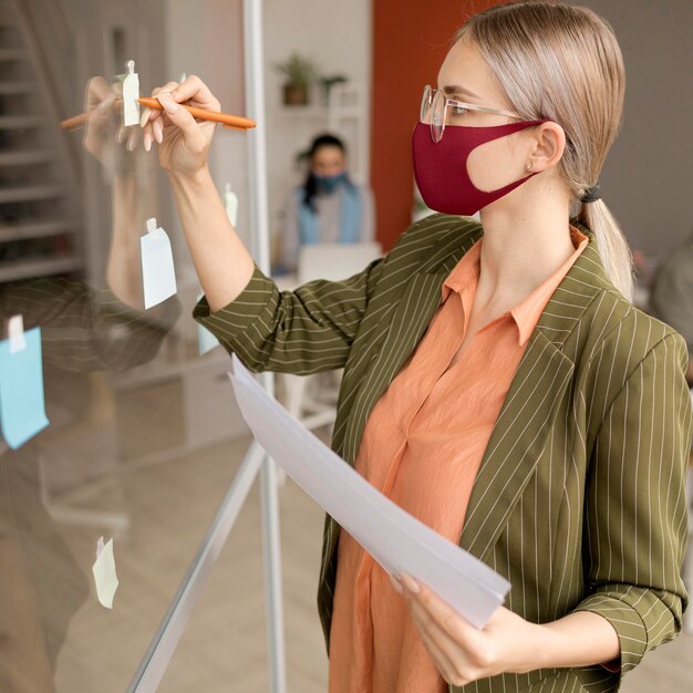 Portrait of woman wearing face mask at work