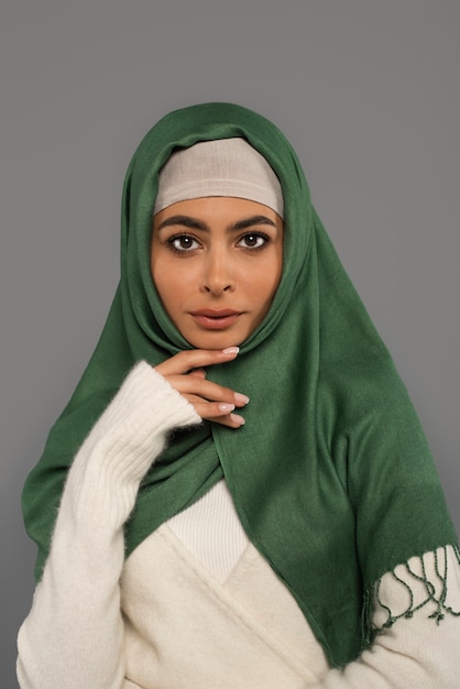 Portrait of woman wearing hijab isolated