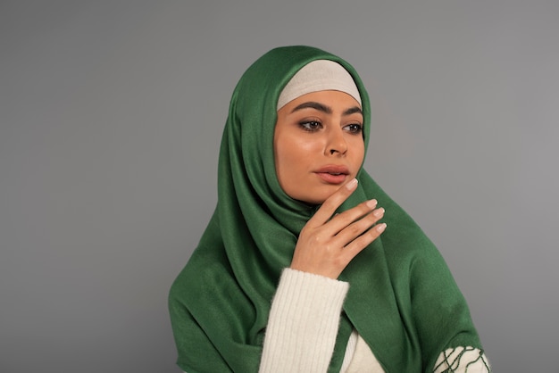 Portrait of woman wearing hijab isolated