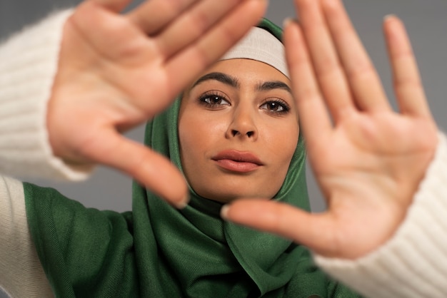 Portrait of woman wearing hijab isolated