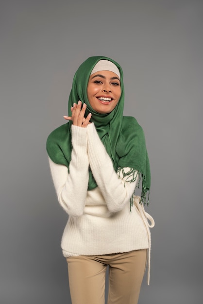 Portrait of woman wearing hijab isolated