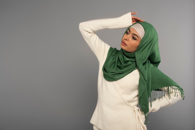 Portrait of woman wearing hijab isolated