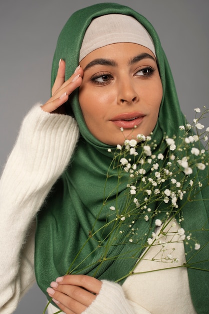 Portrait of woman wearing hijab isolated