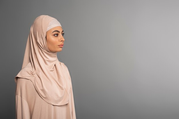 Portrait of woman wearing hijab isolated