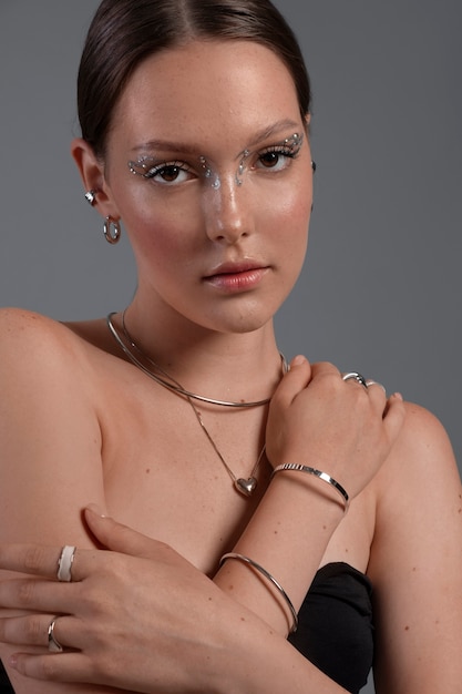 Portrait of woman wearing jewelry makeup