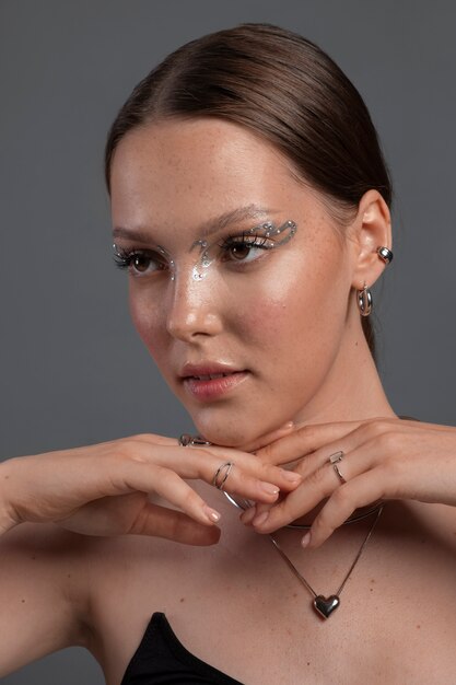 Portrait of woman wearing jewelry makeup