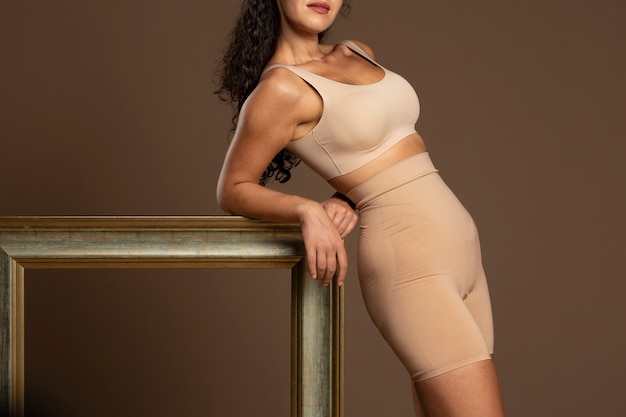 Free photo portrait of woman wearing shapewear