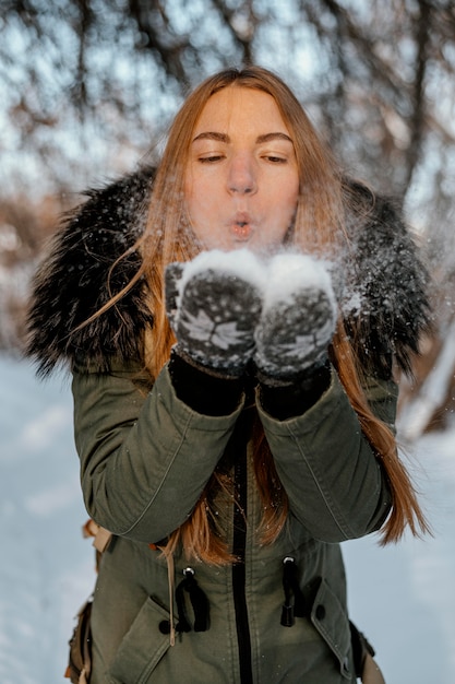 Free Photo portrait woman with backpack on winter day