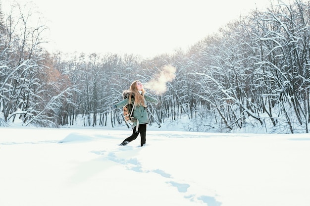 Portrait woman with backpack on winter day