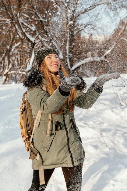 Portrait woman with backpack on winter day