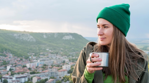 Portrait of woman with beanie enjoying view