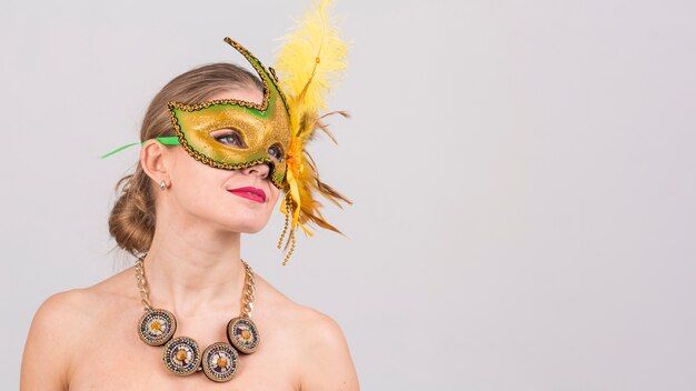 Portrait of woman with carnival mask