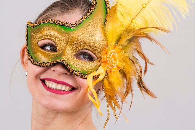 Portrait of woman with carnival mask