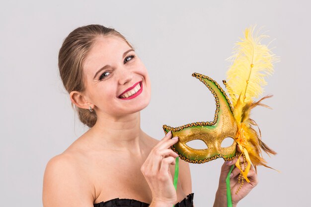 Portrait of woman with carnival mask