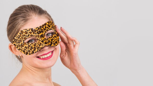 Portrait of woman with carnival mask