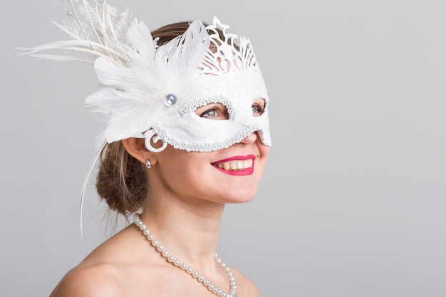 Portrait of woman with carnival mask