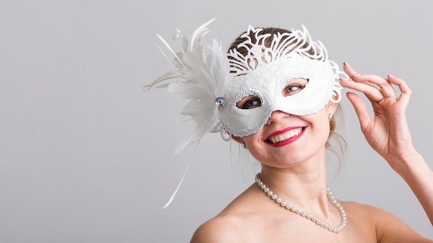 Portrait of woman with carnival mask