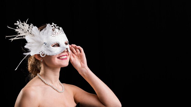 Portrait of woman with carnival mask