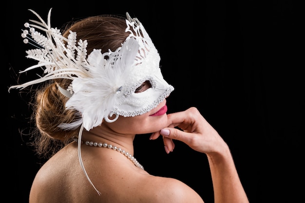 Portrait of woman with carnival mask