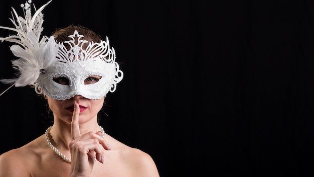 Portrait of woman with carnival mask