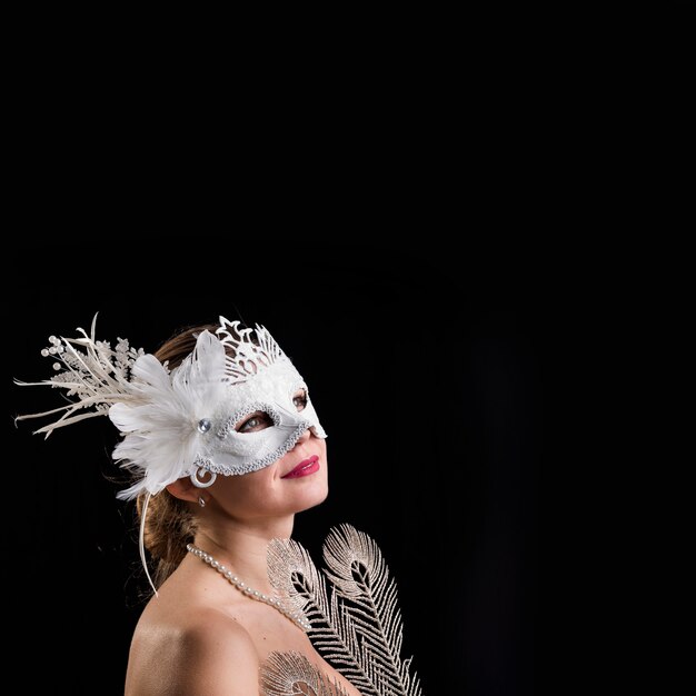 Portrait of woman with carnival mask