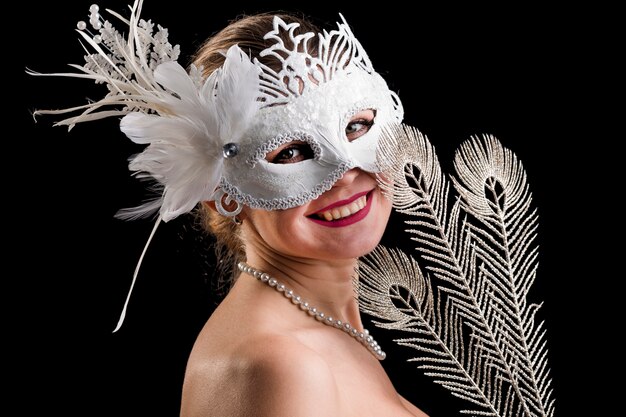 Portrait of woman with carnival mask