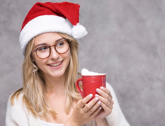 Free Photo portrait of woman with christmas hat