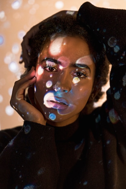 Free Photo portrait of a woman with circles projection