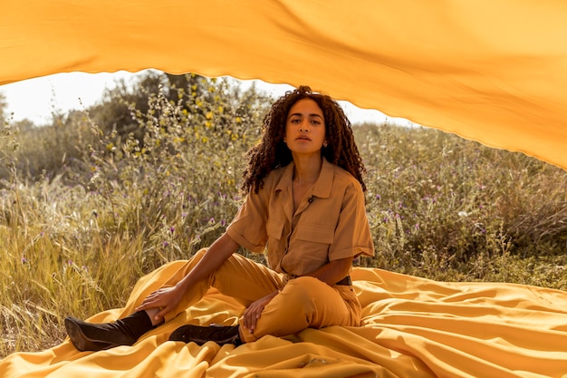 Free Photo portrait of woman with cloth in the fields