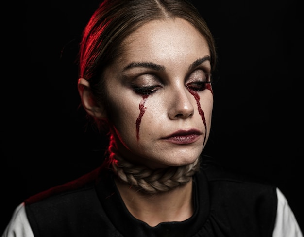 Portrait of woman with fake blood make-up