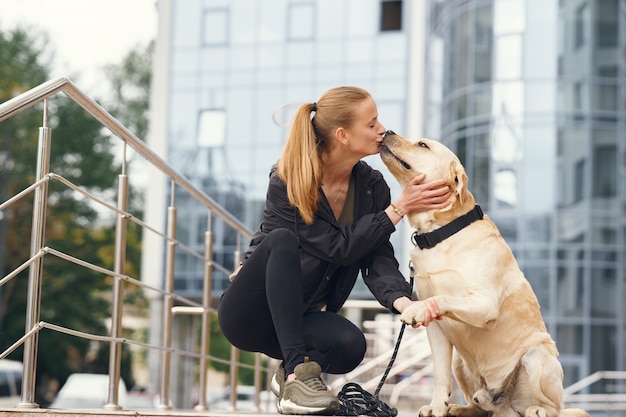 Free Photo portrait of a woman with her beautiful dog