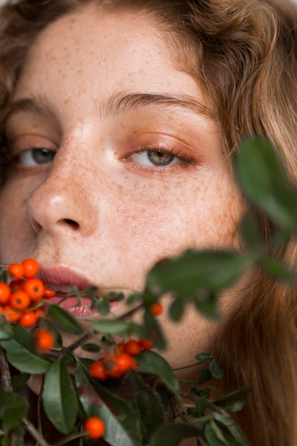 Free Photo portrait of woman with tree and fruits