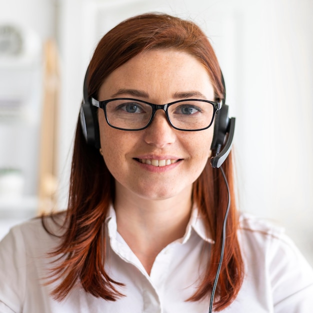 Free Photo portrait woman at work having video call