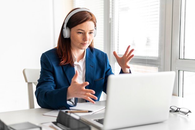 Portrait woman at work having video call