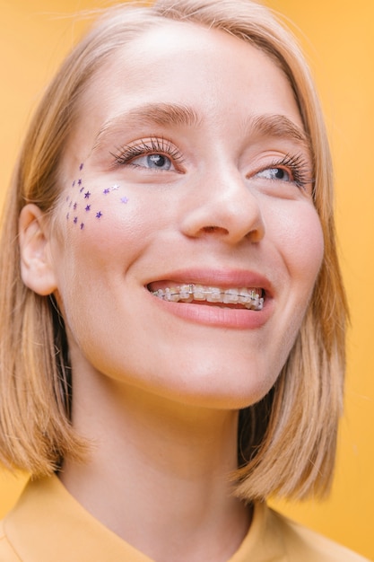 Free Photo portrait of  woman in a yellow scene