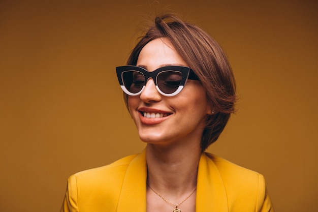 Portrait of woman in yellow suit isolated