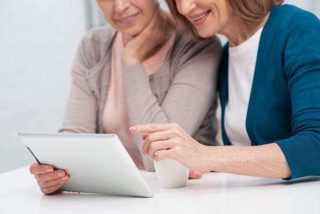 Portrait of women browsing on a tablet